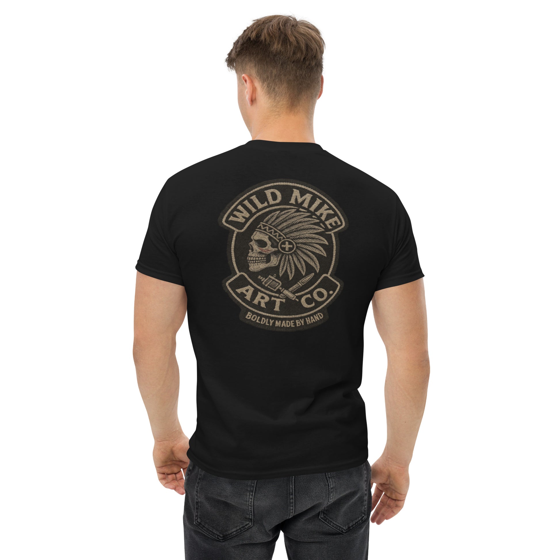Man wearing a black t-shirt with 'Wild Mike Art Co.' logo on the back, on a white background